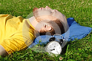 Man sleeping on summer meadow