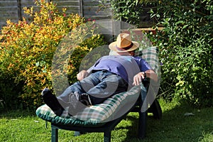 Man sleeping on a sunbed.