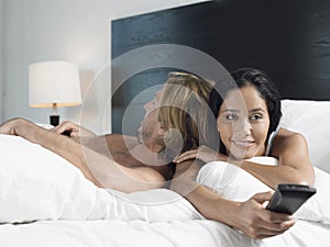 Man Sleeping While Woman Watching TV