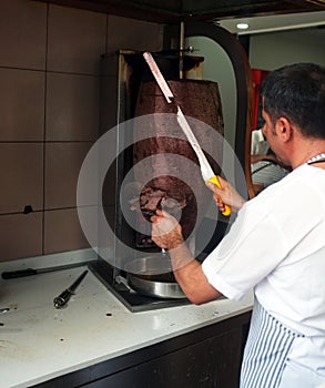 Man slicing doner kebab