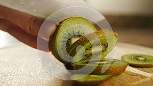 Man slicing kiwi fruit