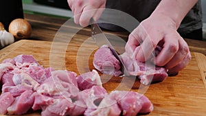 Man slicing pork meat on a table, conceptual idea. Lamb, healthy.