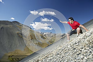 Man Sliding Down Scree Field