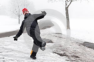 Man is slipping on a icy road