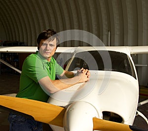 Man beside small airplane