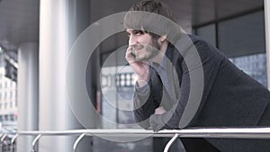 Man with Smart Phone, Young Business Man in Airport. Casual urban Professional Businessman using Smartphone Smiling