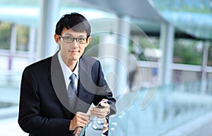 Man on smart phone - young business man. Casual urban profession