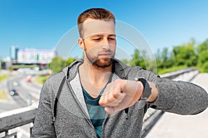 Man with smart watch outdoors