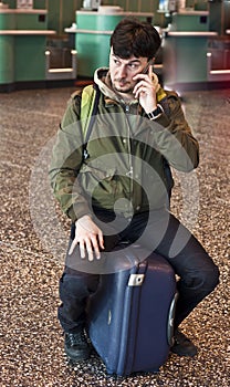 Man with smartphone at the airport