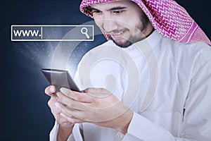 Man with smartphone and www icon