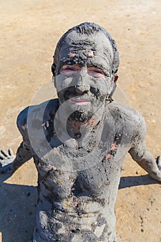 Man smeared with healing mud