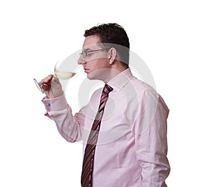 Man smelling a glass of white wine