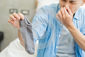 Man with smelly socks photo