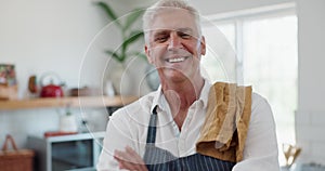 Man, smile and confident with apron in kitchen for cooking, cleaning or preparing meal in house. Elderly person, arms