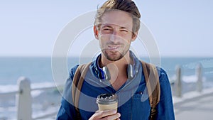 Man, smile portrait and coffee on beach for travel holiday, relax summer vacation or morning freedom in Bali. Happy