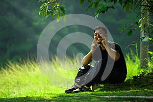 Man with smile under the tree