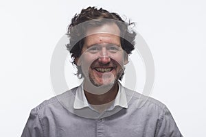 Man smiling against white background, horizontal