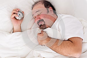 Man smiling in contentment after a good sleep