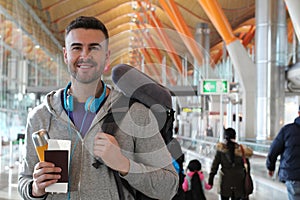 Man smiling in crowded airport