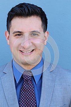 Man smiling face expression. Male emotional expression on blue background. Concept photo of happiness, satisfaction