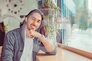 Man smiling looking at you camera at home