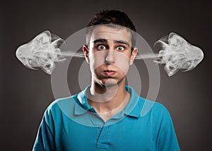 Man with smoke on her ears