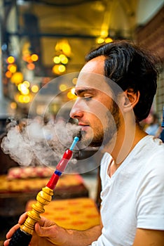 Man smoking turkish hookah