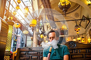 Man smoking turkish hookah