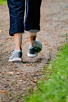 Man with sneakers running on a path, helathy activity to make exercice