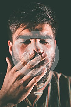 Man sniffing cocaine