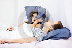 Man snoring in bed