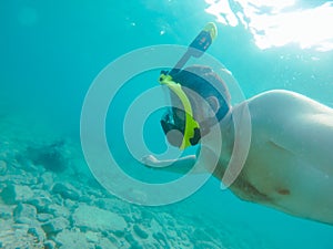 man with snorkeling mask underwater summer sea vacation