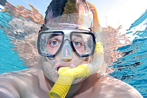 Man snorkelling in a swimming pool