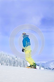 Man on snowboard in mountains