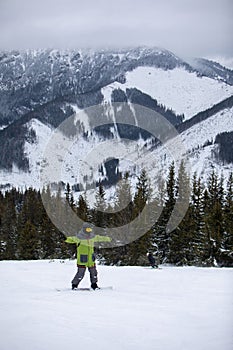 Man snowboarder portrait on ski slope