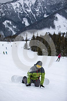 Man snowboarder portrait on ski slope