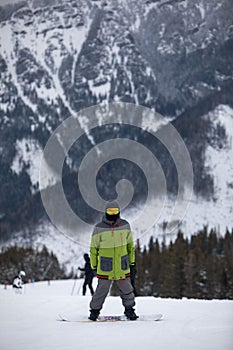 Man snowboarder portrait on ski slope