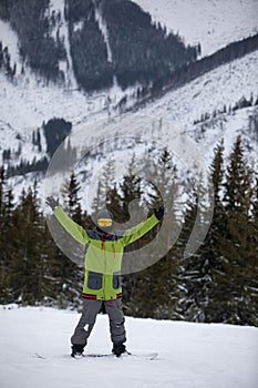 Man snowboarder portrait on ski slope