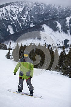 Man snowboarder portrait on ski slope