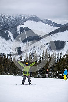 Man snowboarder portrait on ski slope