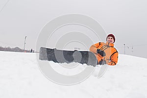 man snowboarding down by hill