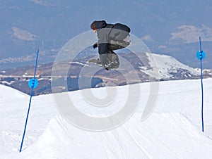 Man snowboarding on slopes of Pradollano ski resort in Spain