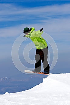 Man snowboarding on slopes of Pradollano ski resort in Spain