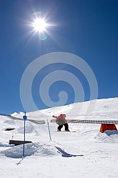 Man snowboarding on slopes of Pradollano ski resort in Spain