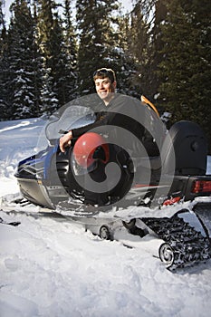 Man on snowmobile.