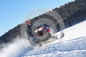 Man Snowmobiling Through img
