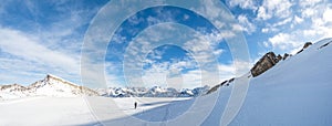 Man is snowshoe hiking in amazing alpine winter mountains landscape. Ifen, Haehlekopf, Vorarlberg, Austria.