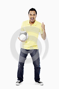 Man with soccer ball showing thumbs up. Conceptual image
