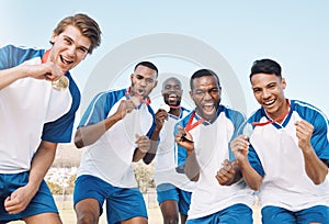 Man, soccer players and celebration with gold medal for victory, championship or winning match or game. Portrait of