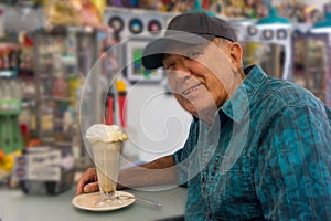 Man in Soda Fountain with Ice Cream Milk Shake